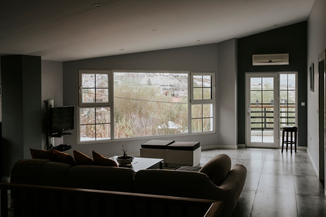 Modern living room with large tinted windows