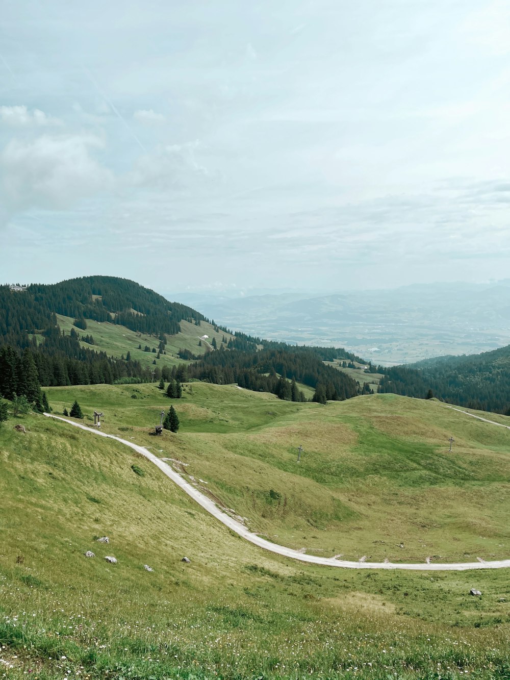 green grass field and mountain during daytime