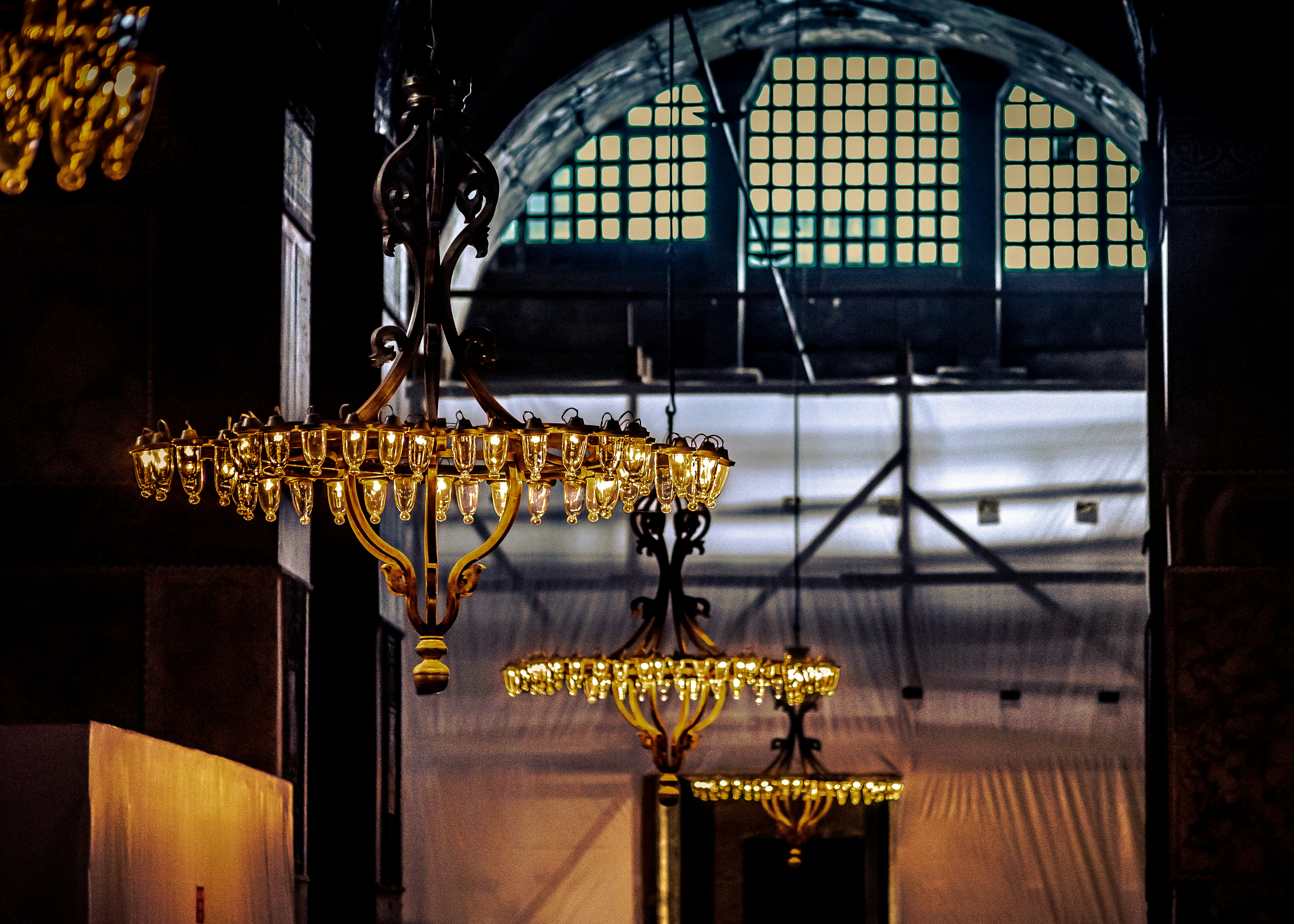 brass uplight chandelier inside building