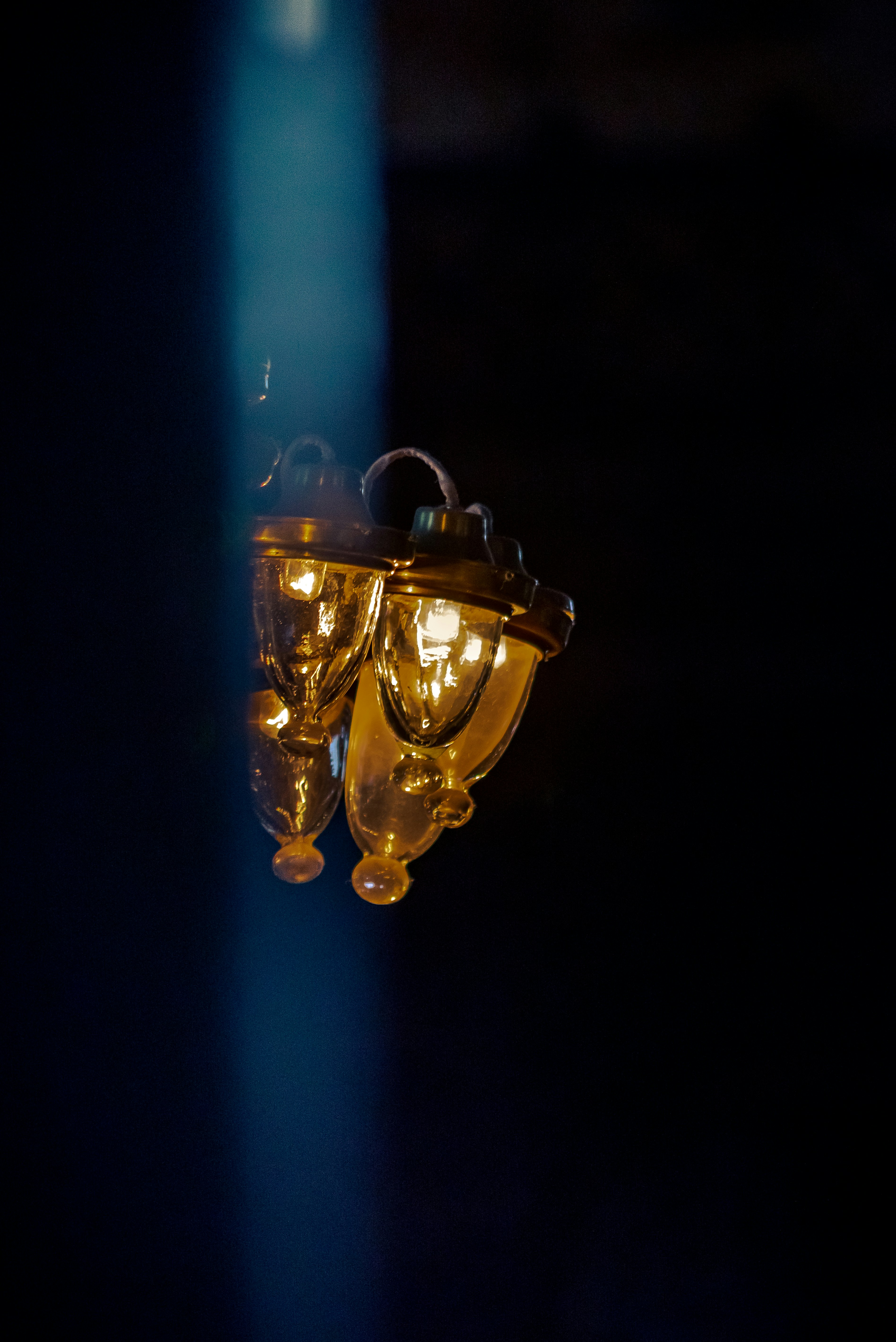 brass and blue light bulb