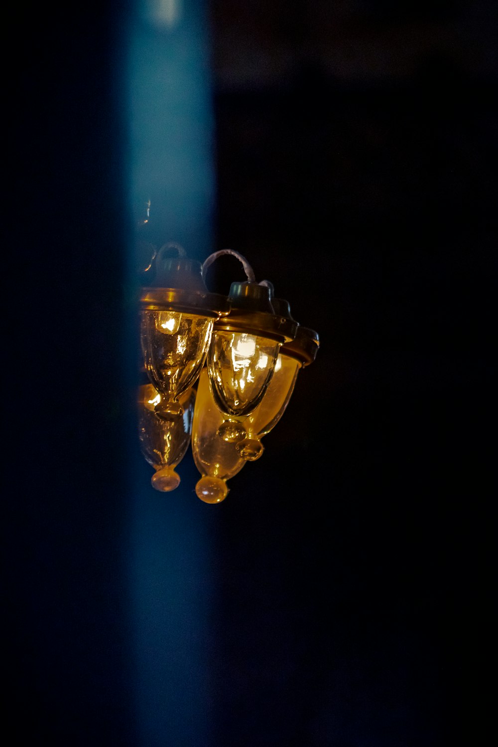brass and blue light bulb
