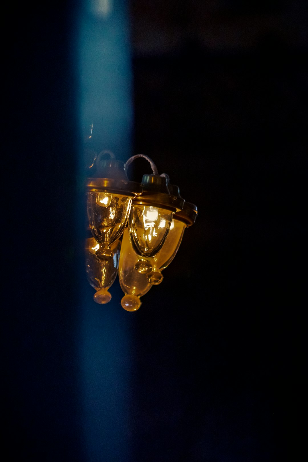 brass and blue light bulb