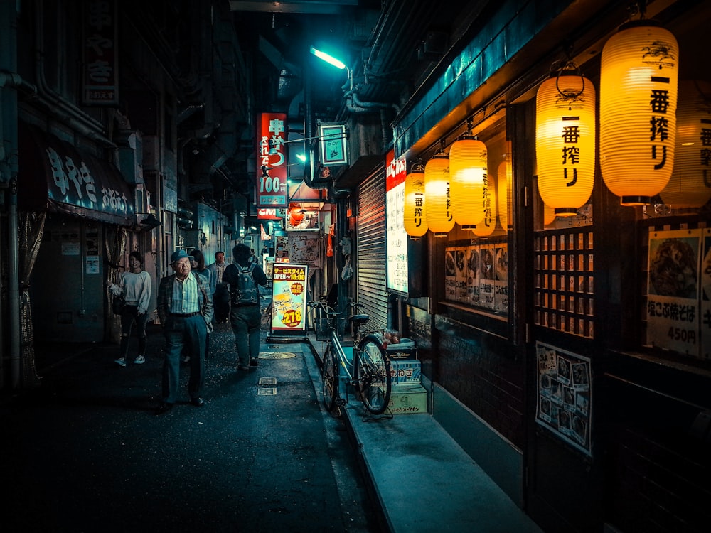 people walking on street during night time