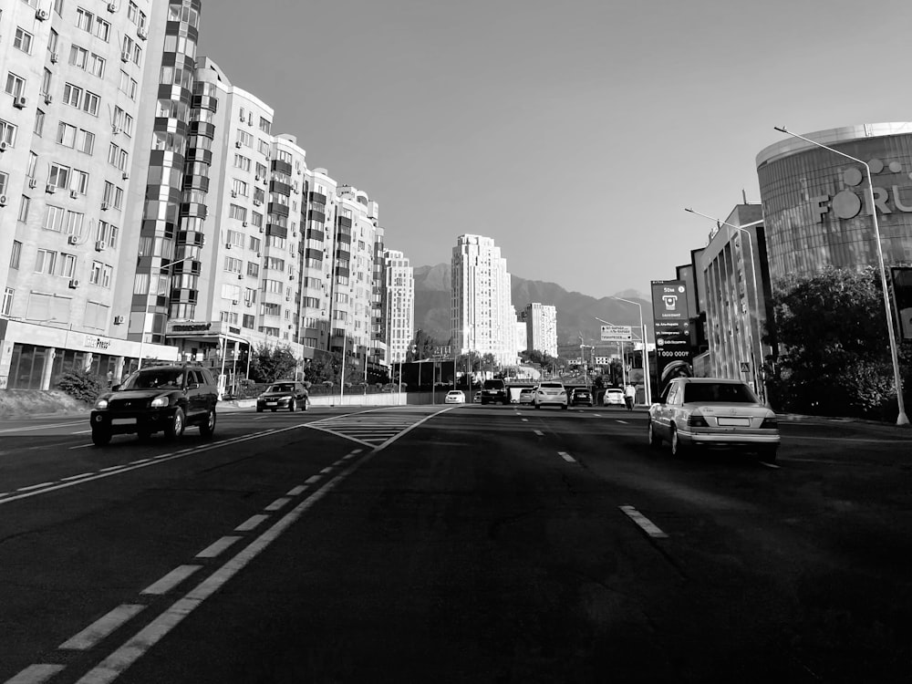 grayscale photo of city buildings