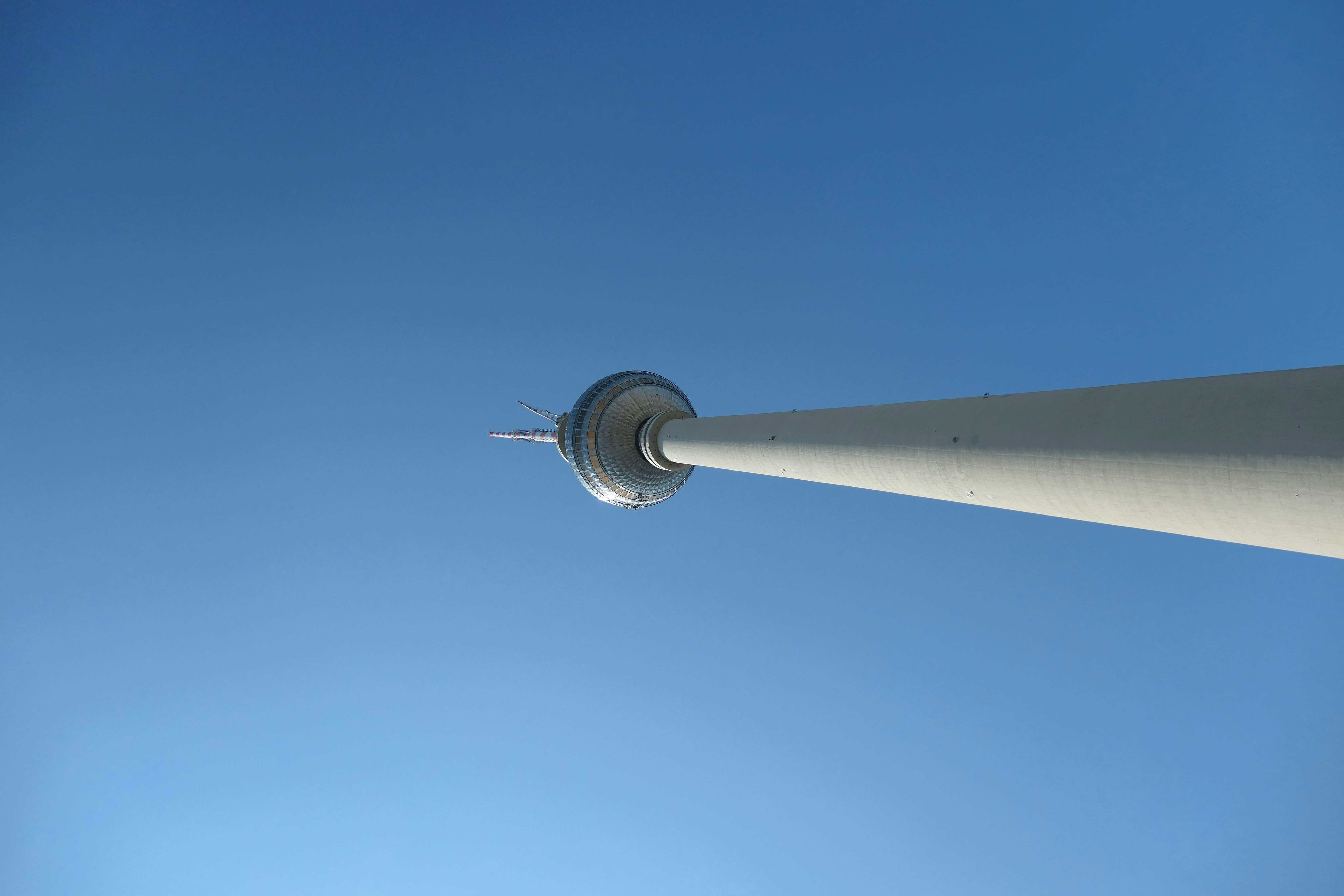 white and black metal post under blue sky during daytime