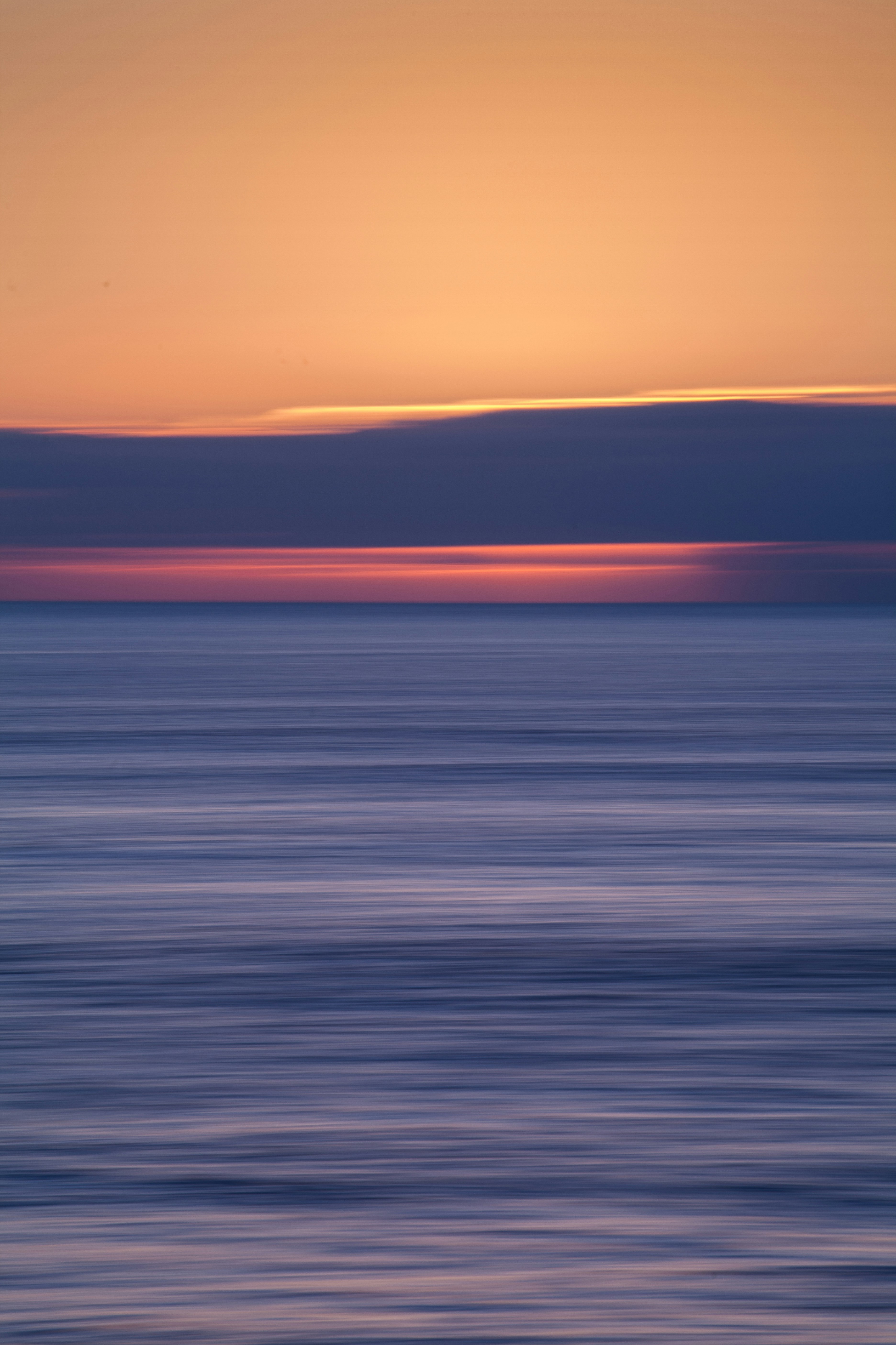body of water during sunset