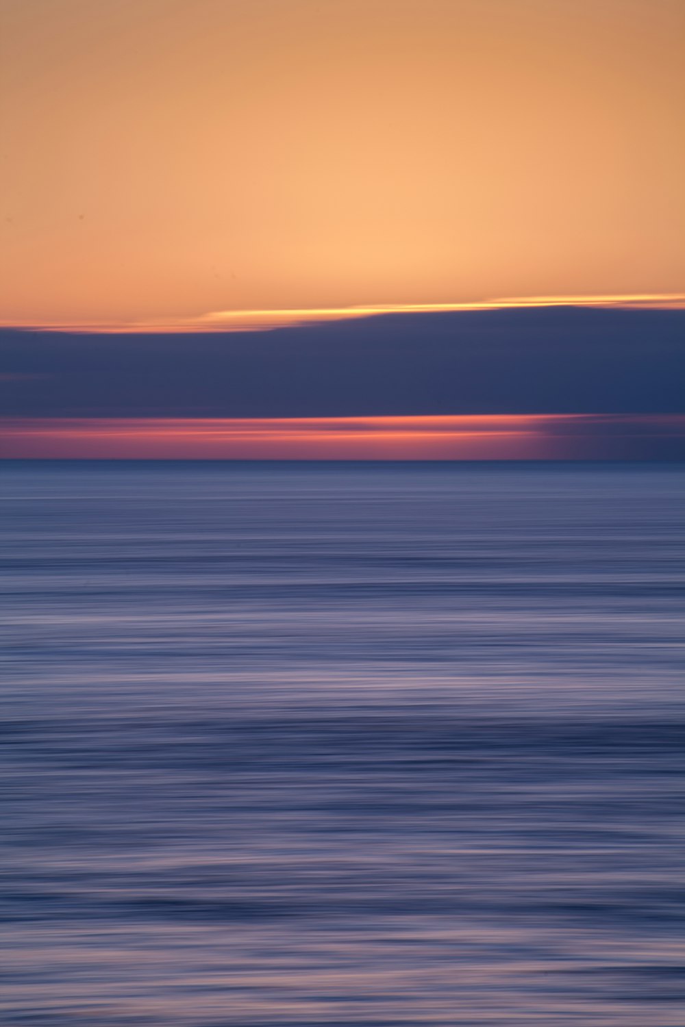 body of water during sunset