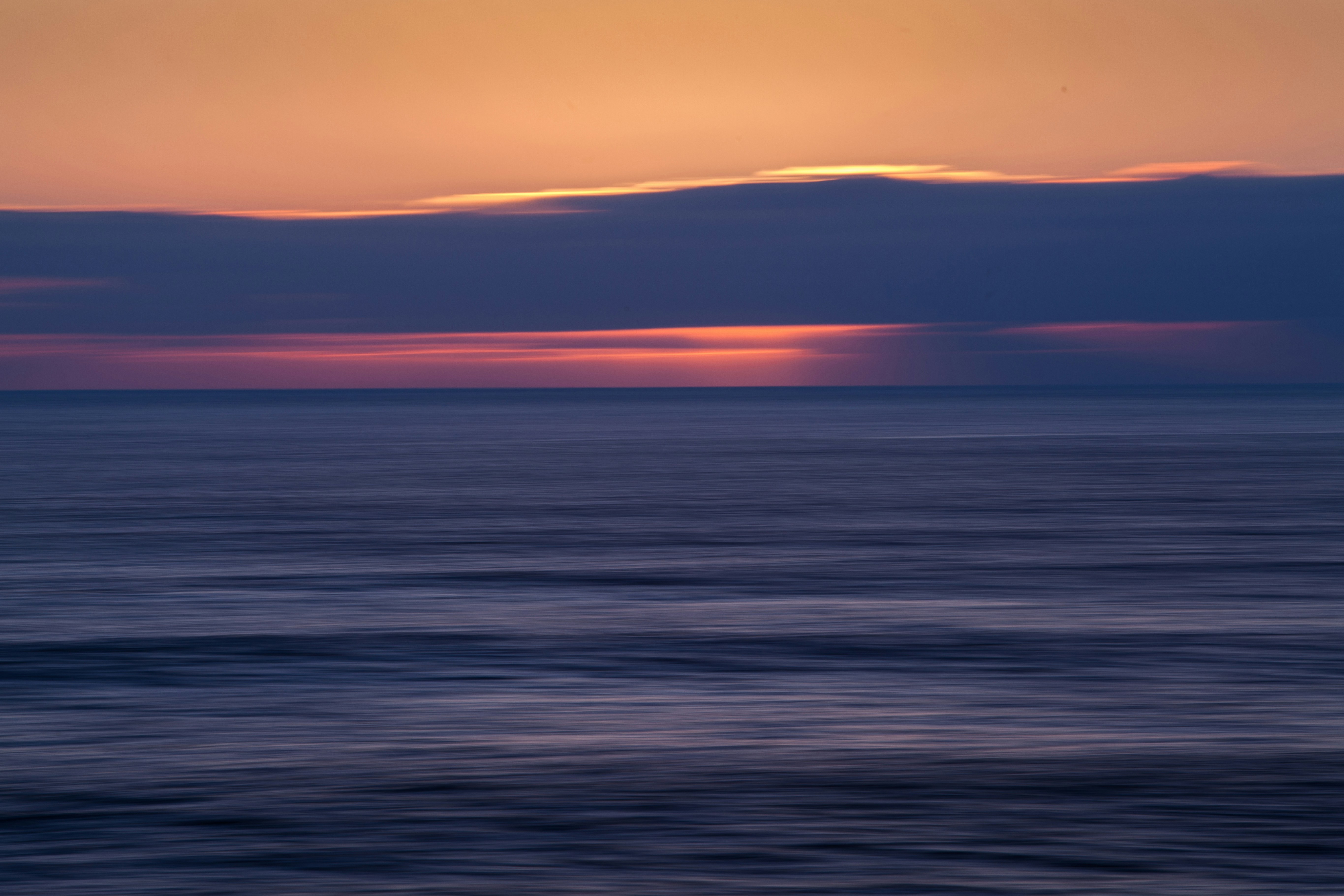 body of water during sunset