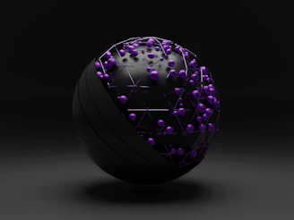 purple and green ball on white surface