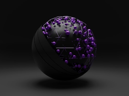 purple and green ball on white surface