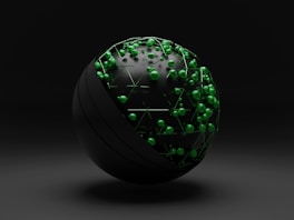 green and white ball on white surface