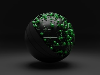 green and white ball on white surface