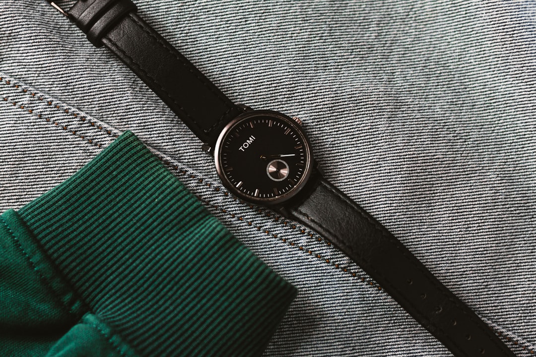 black strap round analog watch