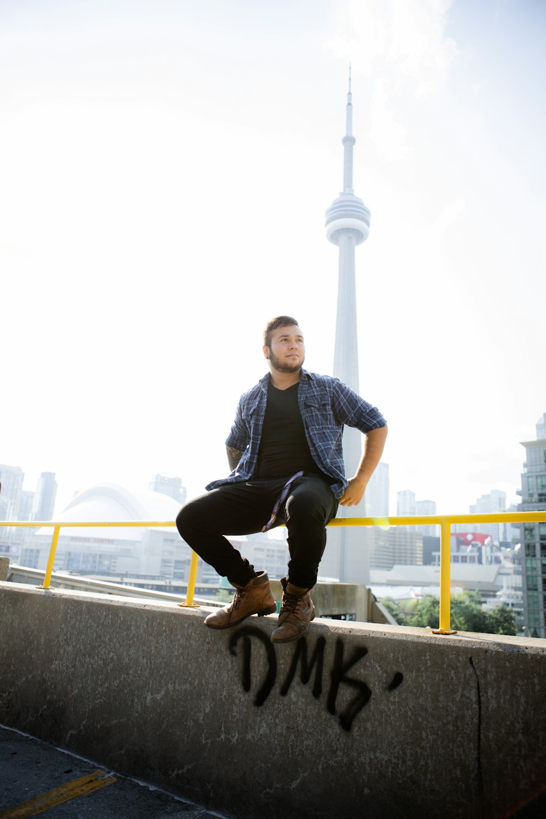 man in blue and white stripe crew neck t-shirt and black pants sitting on white