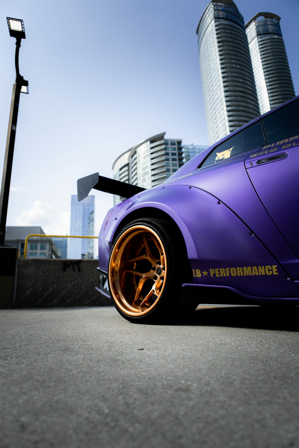 purple porsche 911 parked on parking lot during daytime