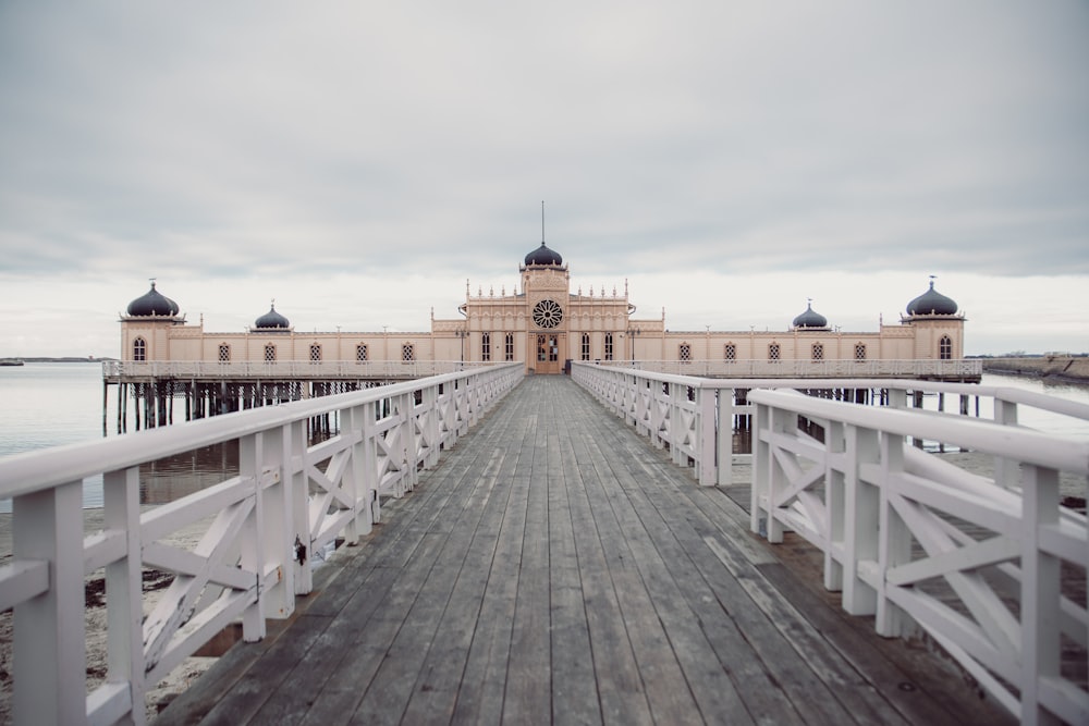 white wooden bridge under white sky during daytime