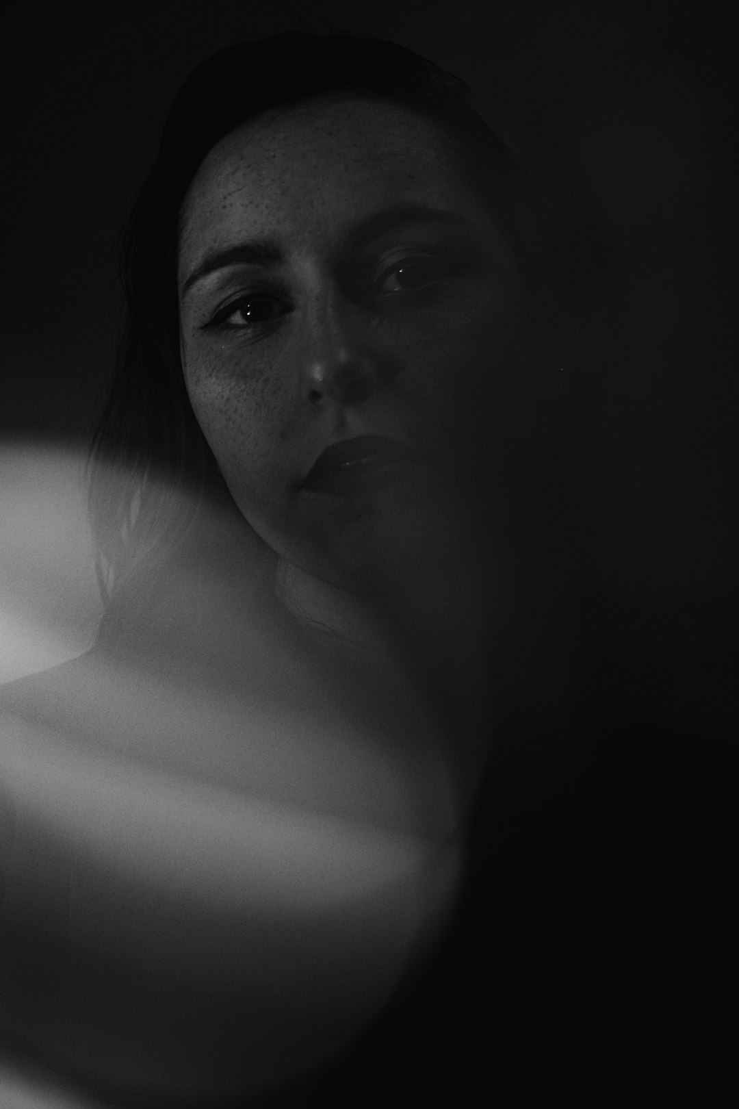 grayscale photo of womans face