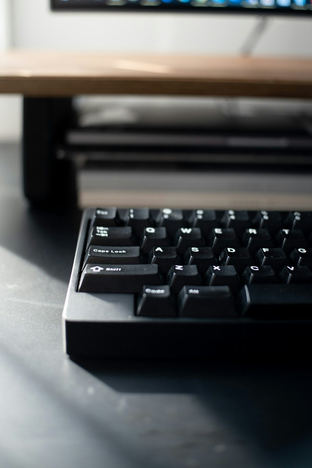 black computer keyboard on white table