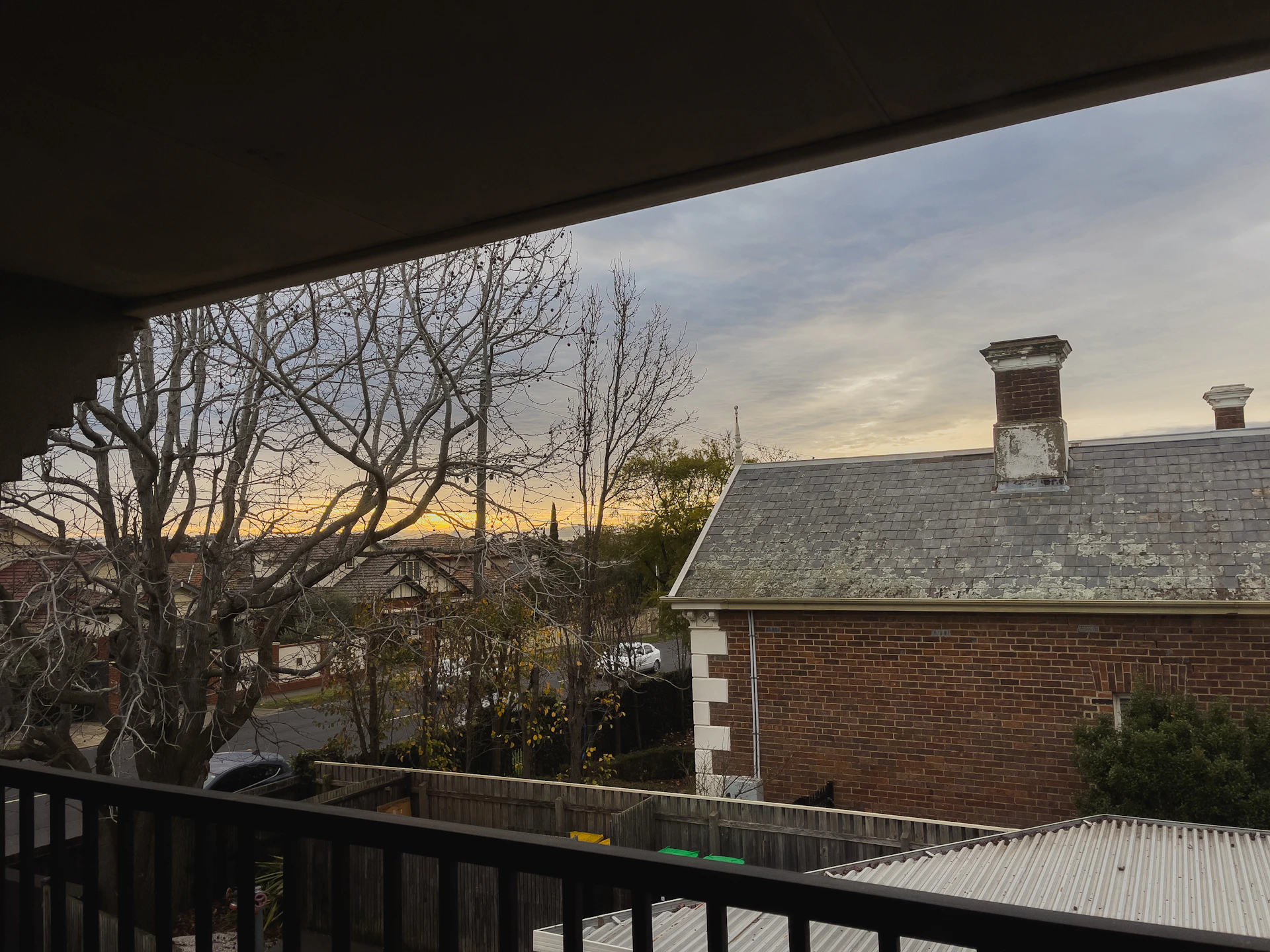 woman wearing yellow long-sleeved dress under white clouds and blue sky during daytime