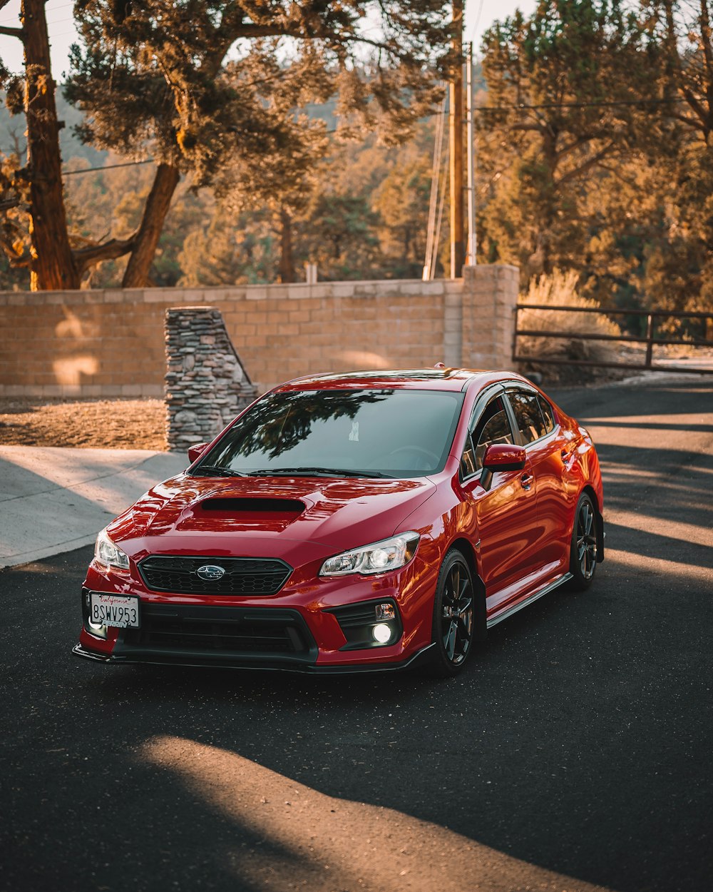 red honda car on road during daytime