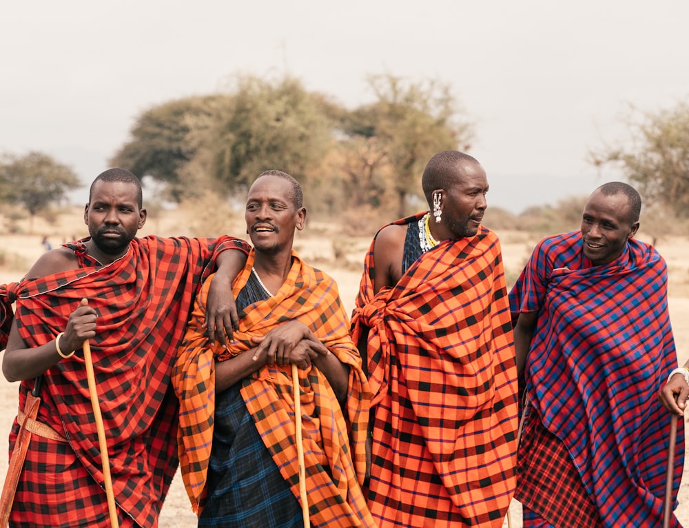 group of people in red and black plaid robe