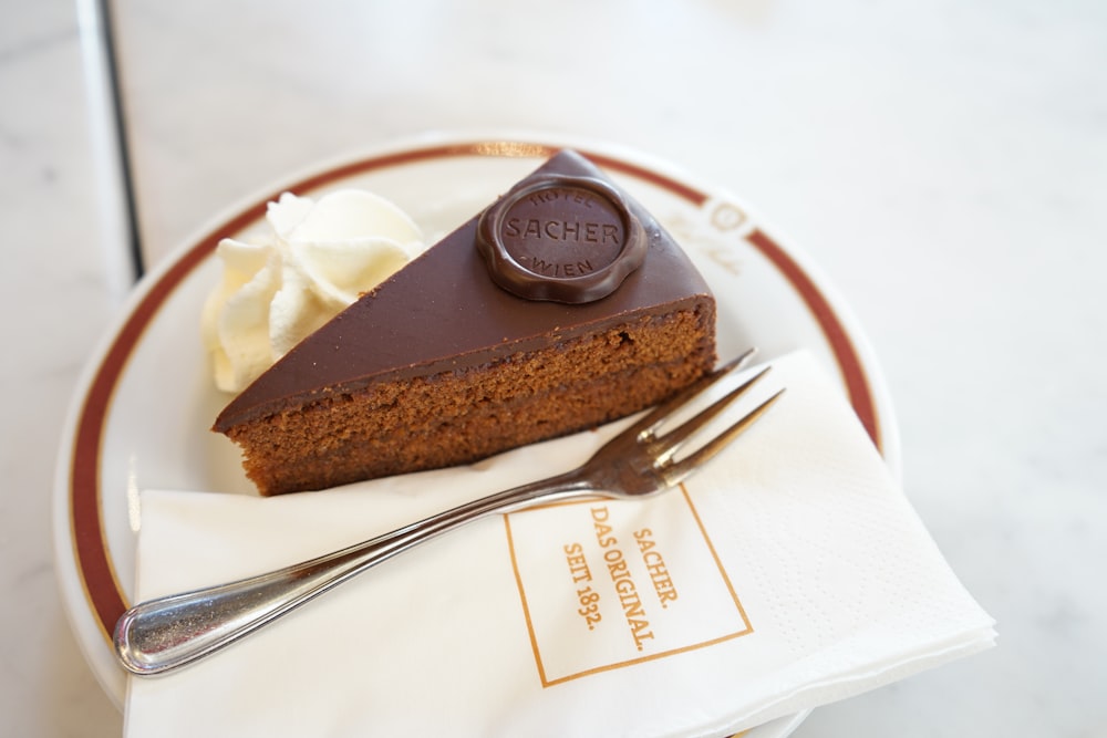 sliced chocolate cake on white ceramic plate