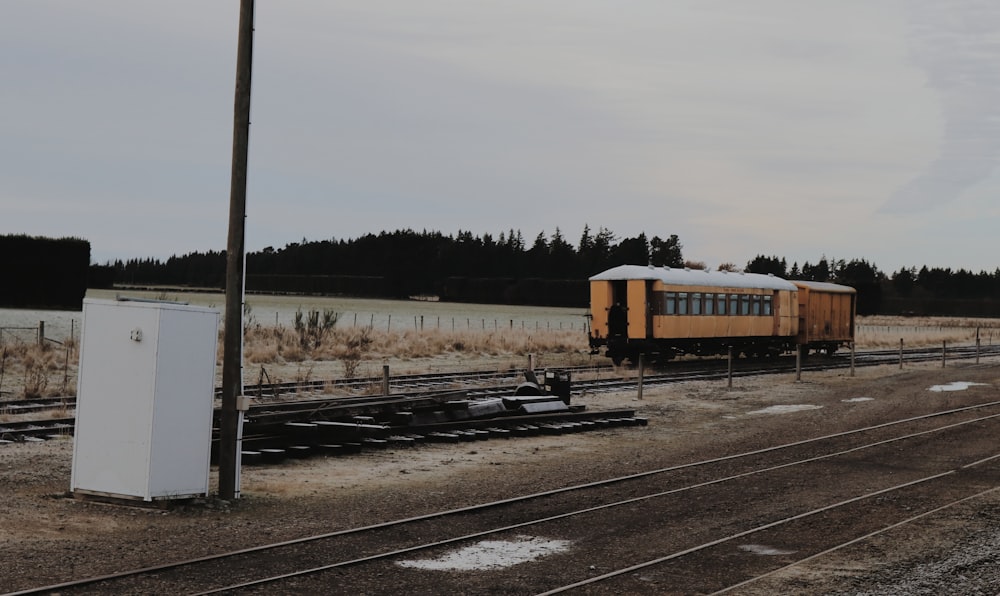brown and white train on rail tracks during daytime