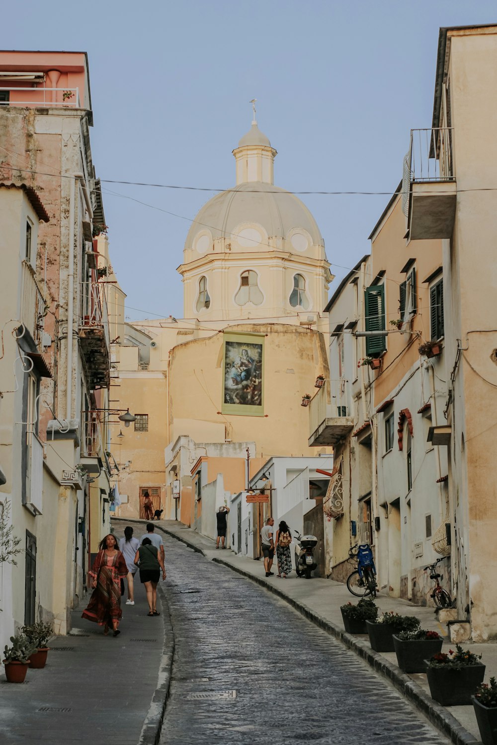 people walking on street near buildings during daytime