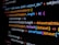 Lines of computer code are displayed on a dark background, featuring SQL and JavaScript syntax with colorful syntax highlighting. The code includes a SQL query and JavaScript function handling datasets.