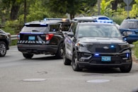 black mercedes benz suv on road during daytime