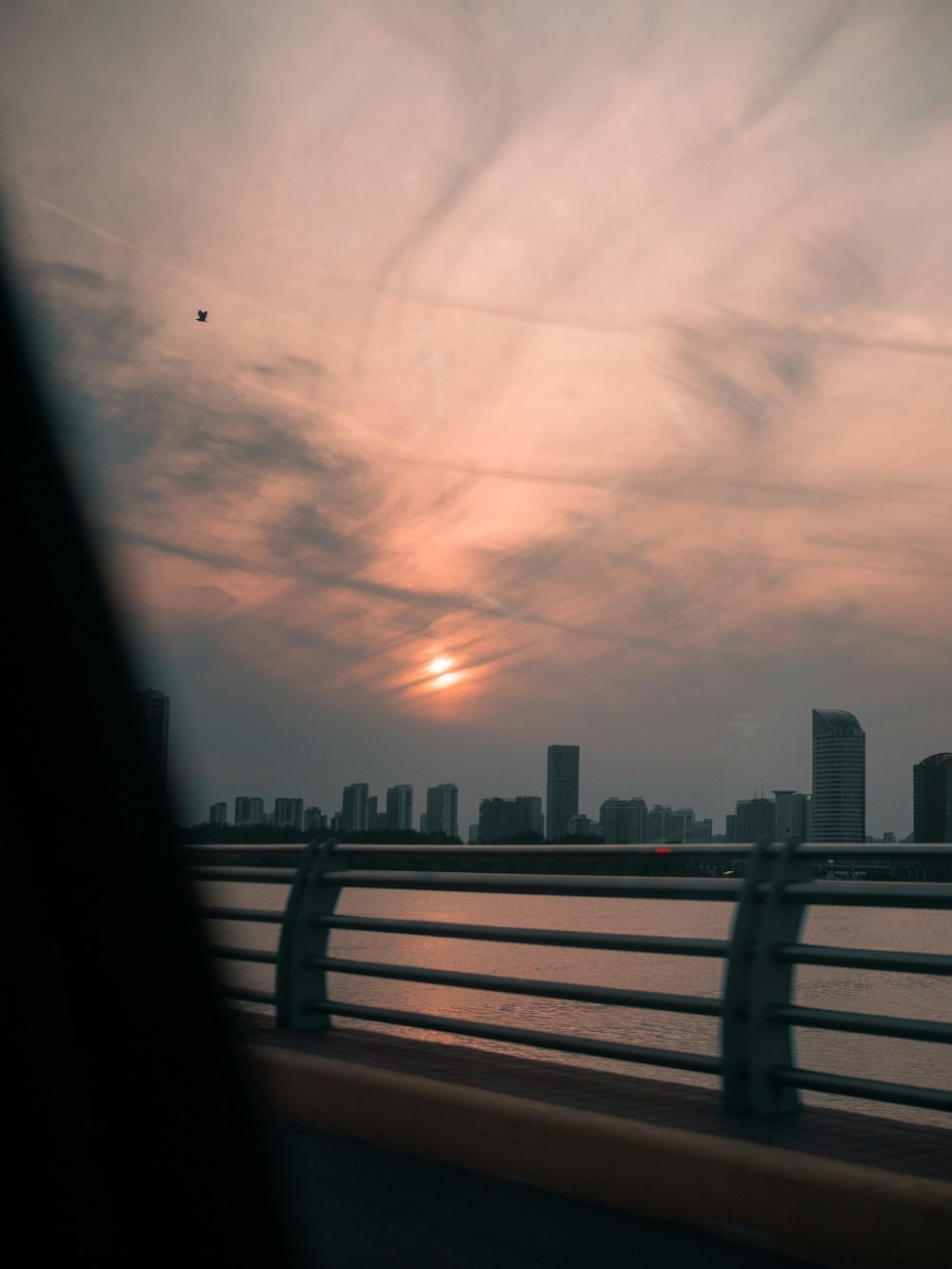 city skyline under cloudy sky during daytime