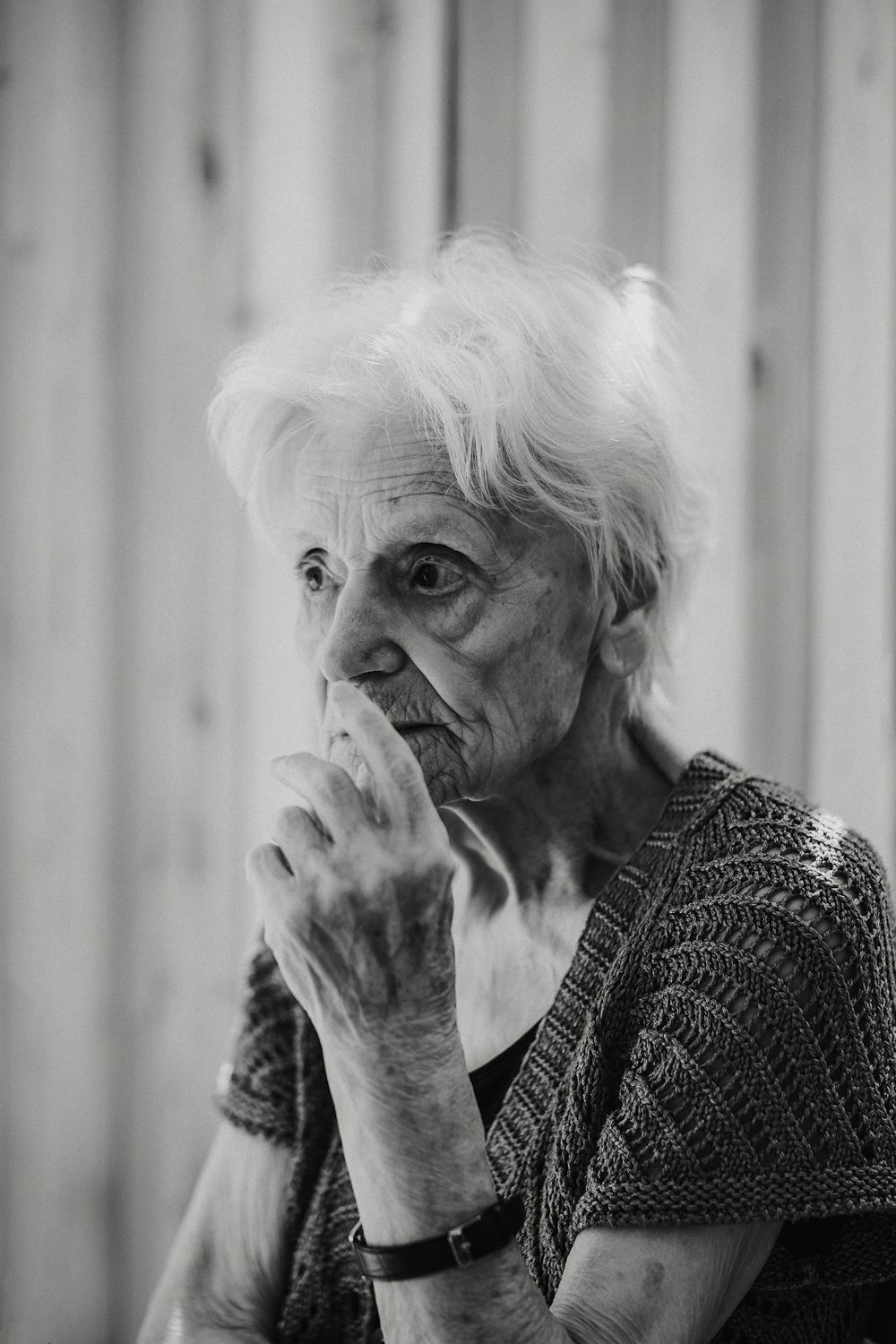 grayscale photo of woman in knit sweater