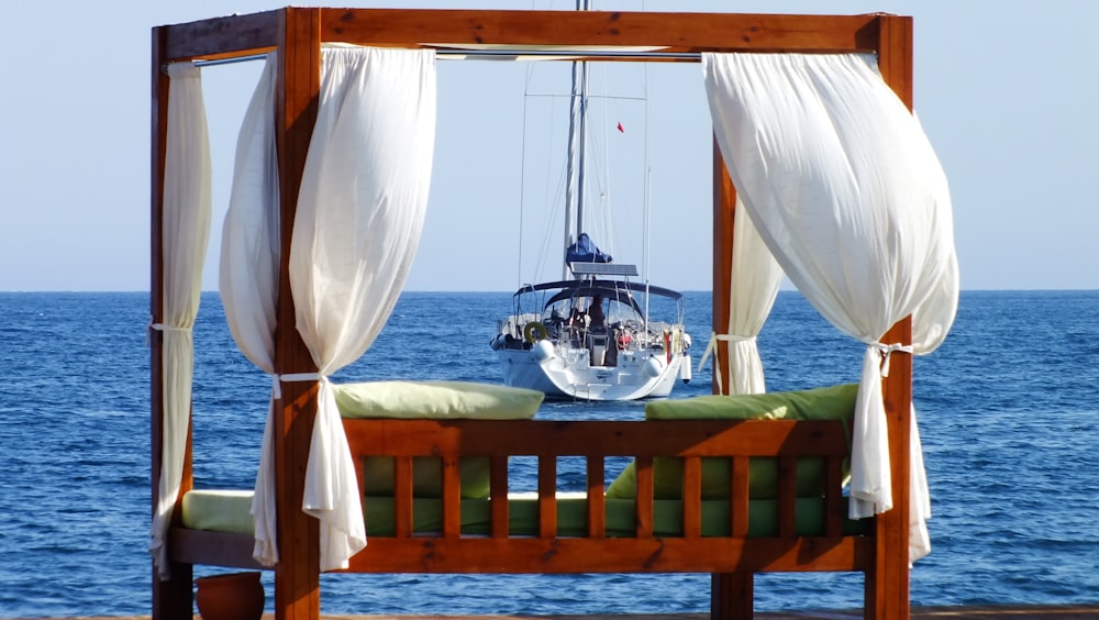 white and brown boat on sea during daytime