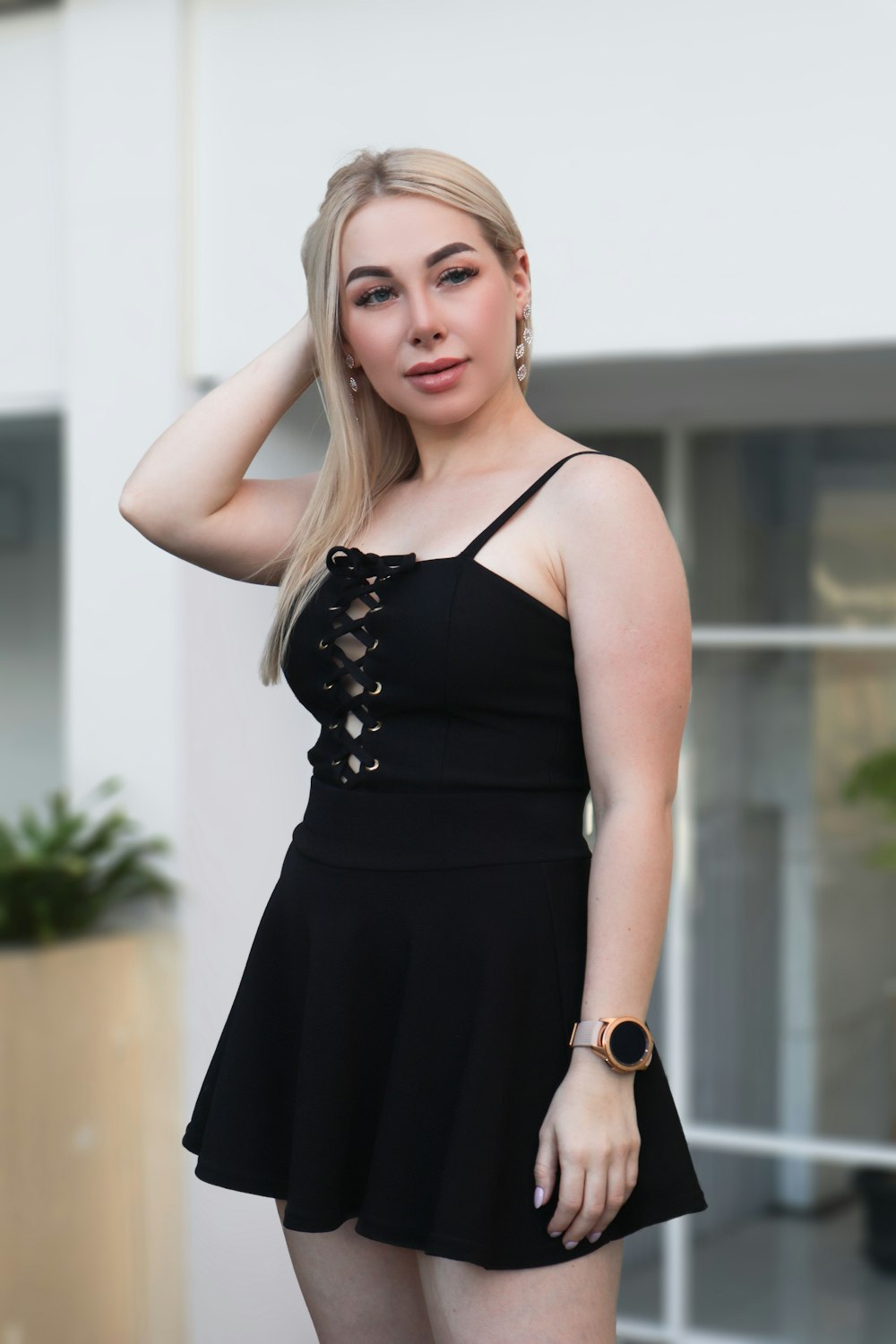 woman in black spaghetti strap dress