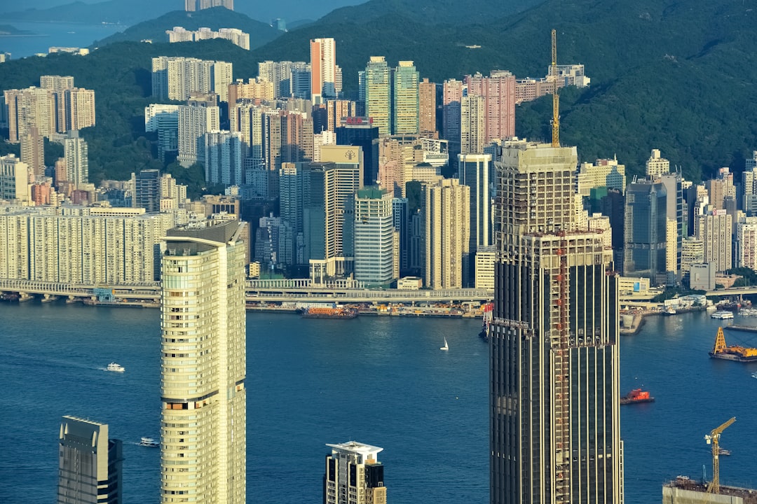 high rise buildings near body of water during daytime