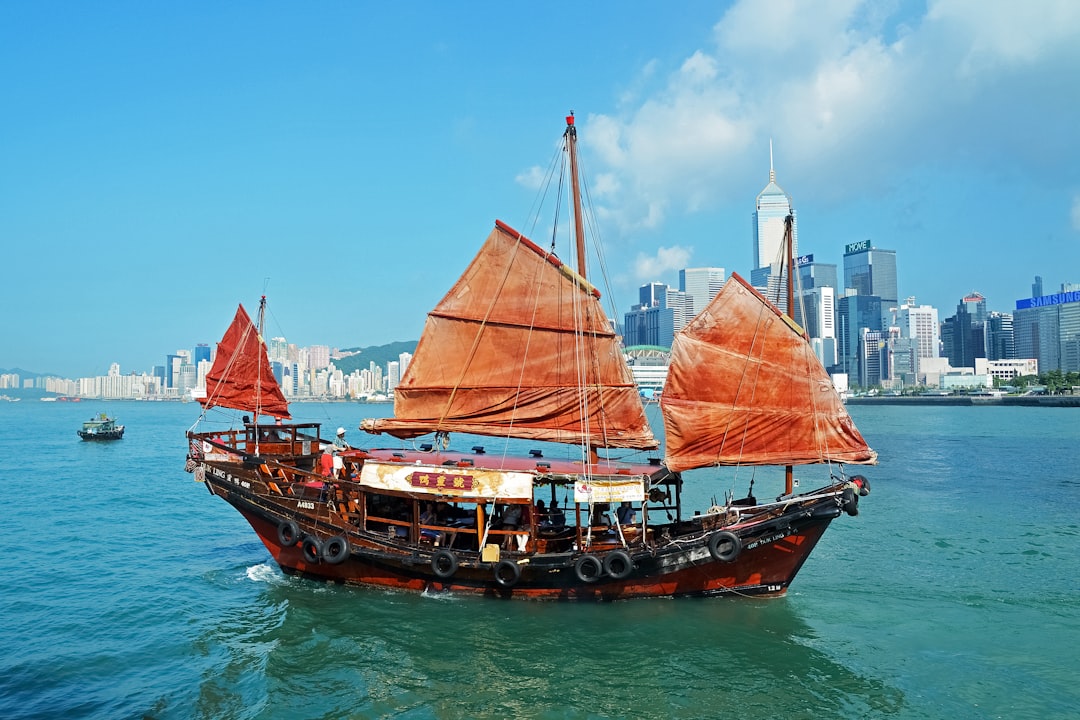 brown sail ship on water during daytime