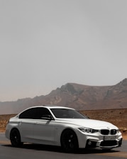 A sleek rental car parked in a scenic location, ready for a journey.