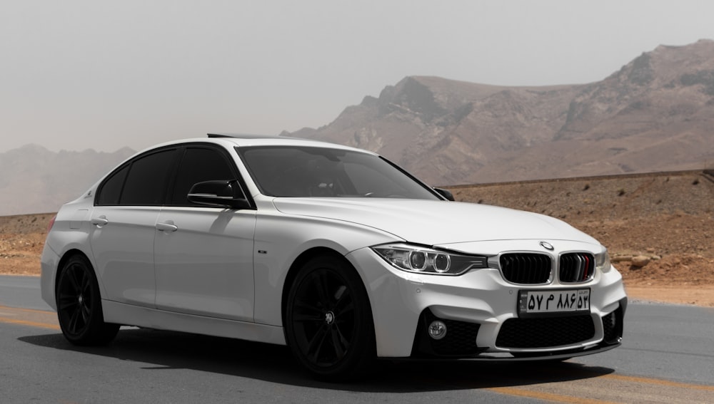 white bmw m 3 coupe on road during daytime