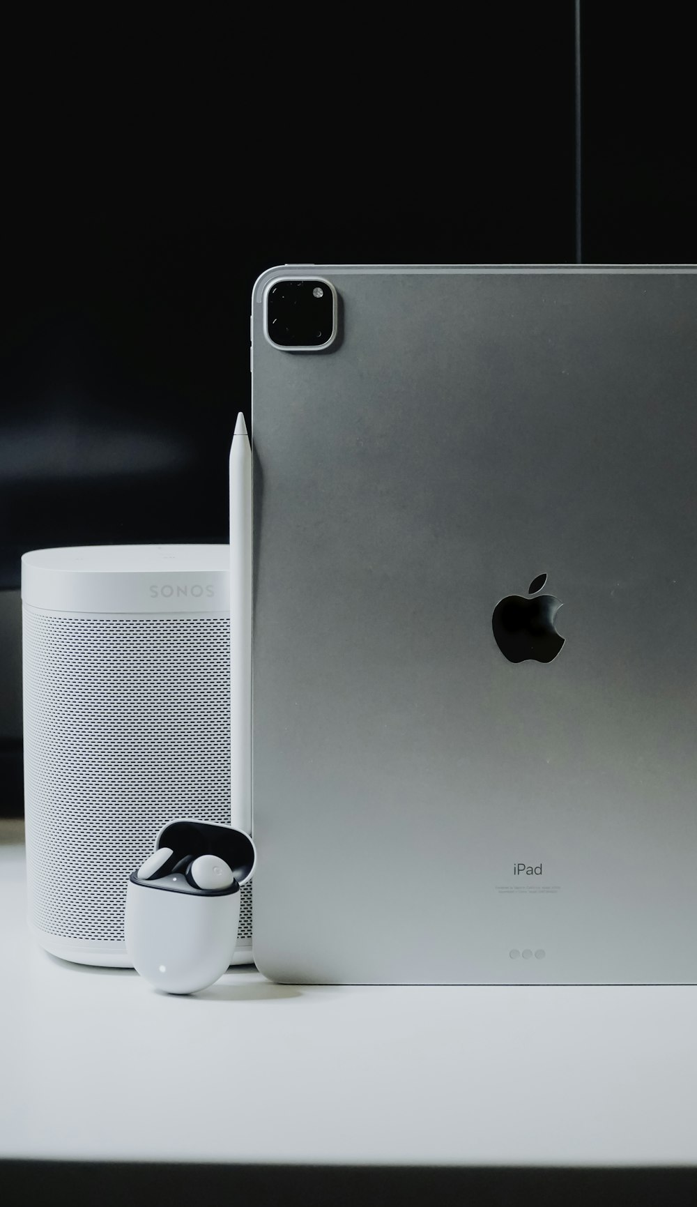 silver iphone 6 beside white and black ceramic mug