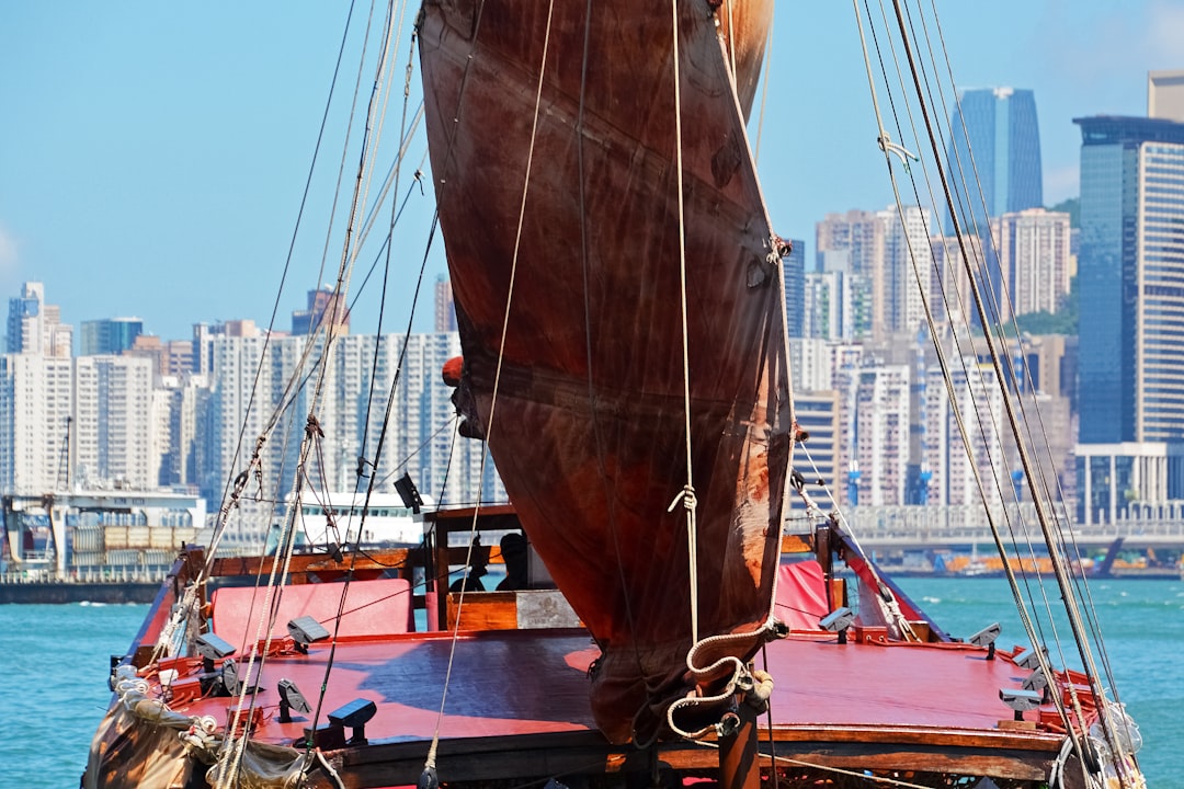 brown sail boat on dock during daytime