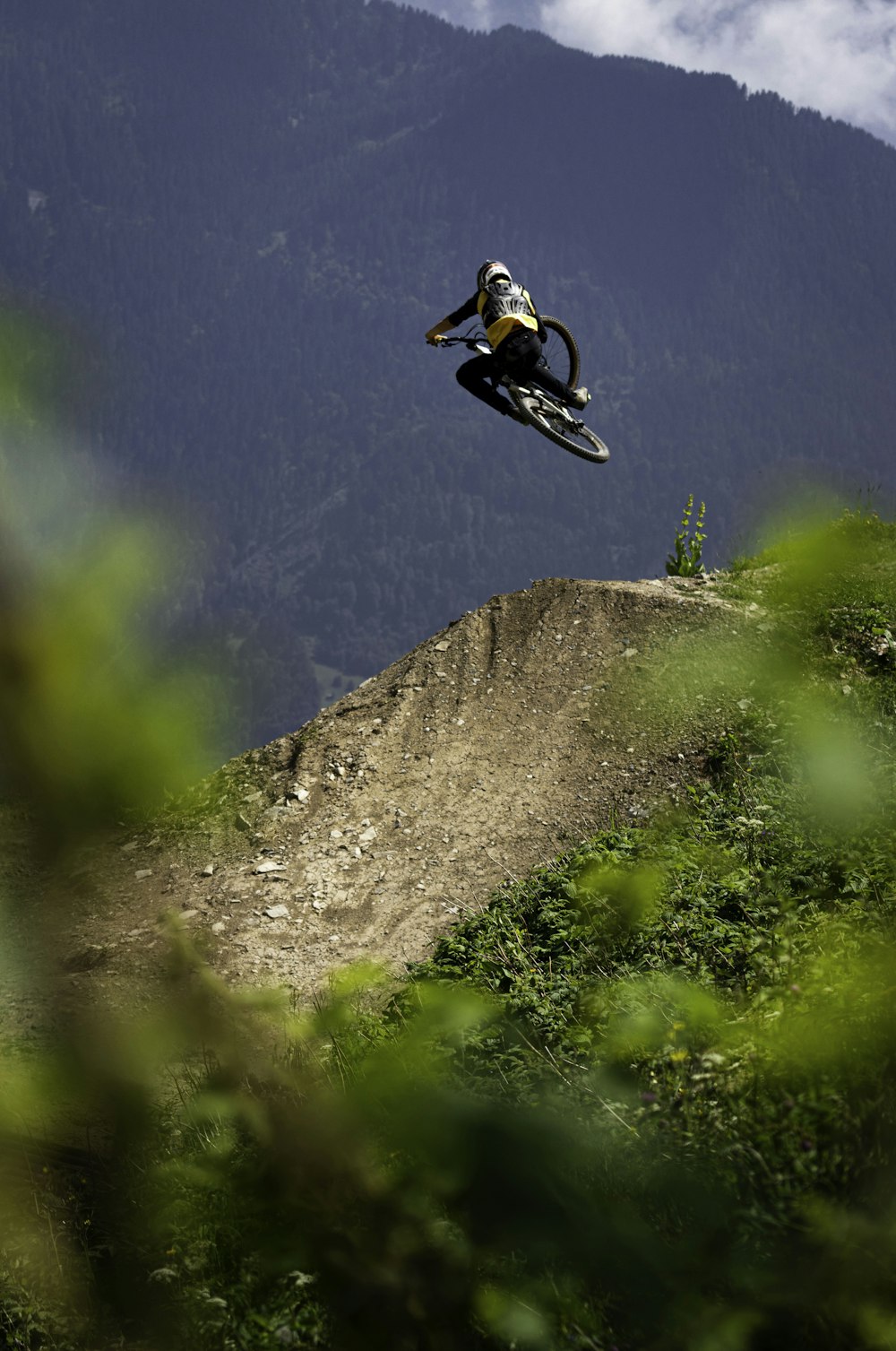 man in white and black jacket riding on white and black motocross dirt bike during daytime