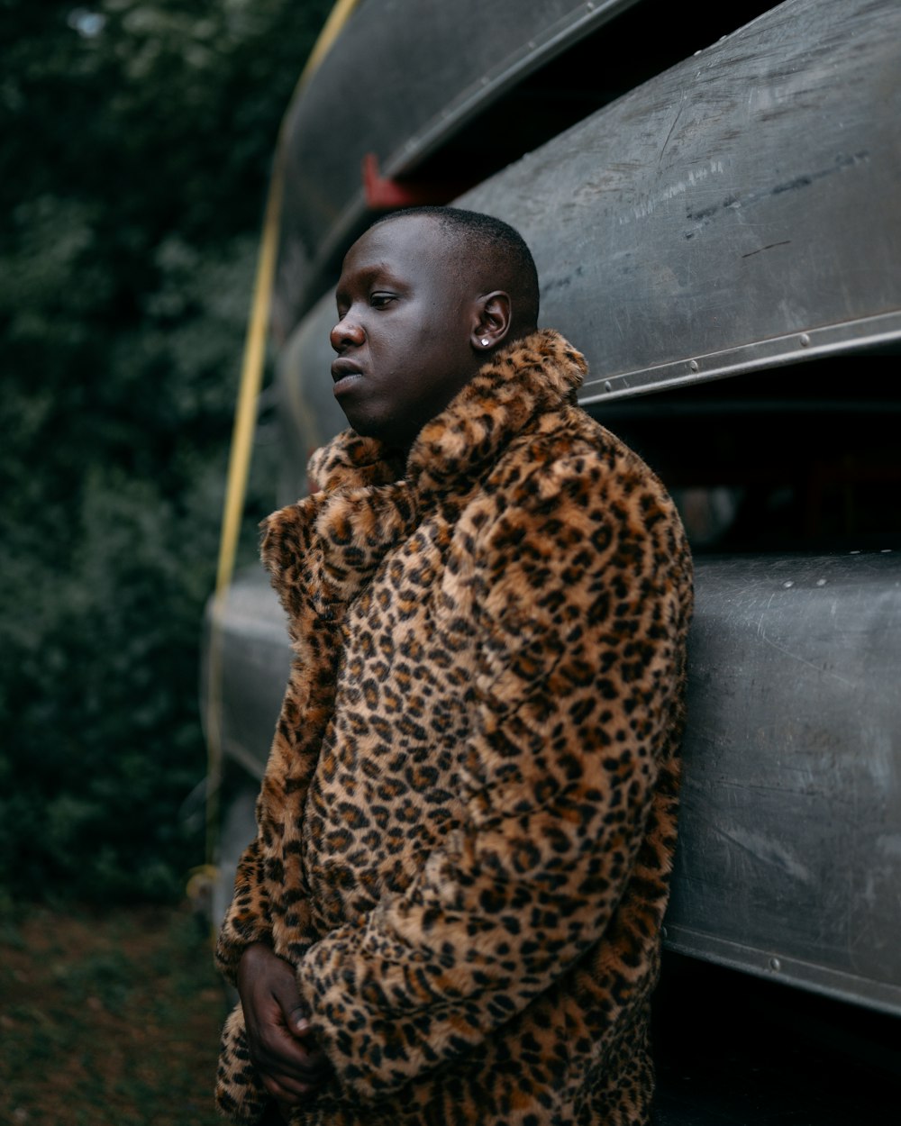 woman in brown and black leopard print coat