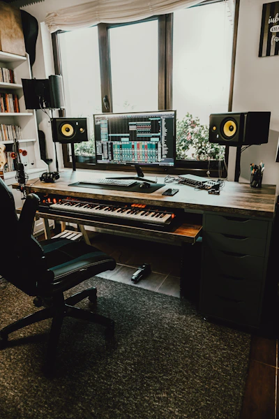 black flat screen computer monitor on brown wooden desk