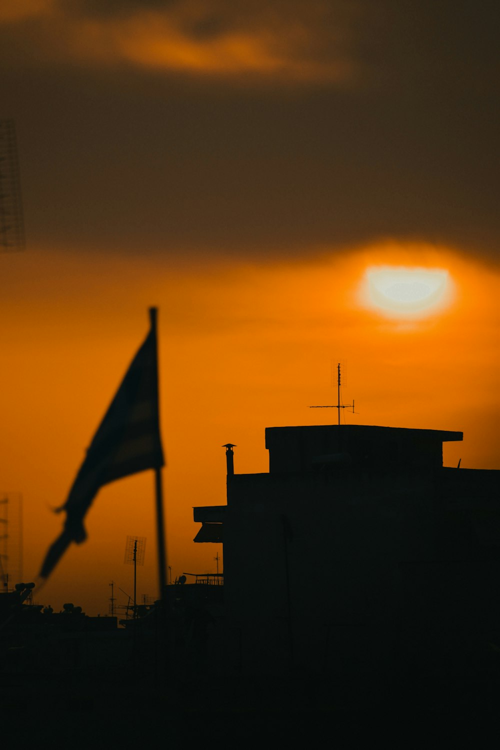 silhouette of flag during sunset