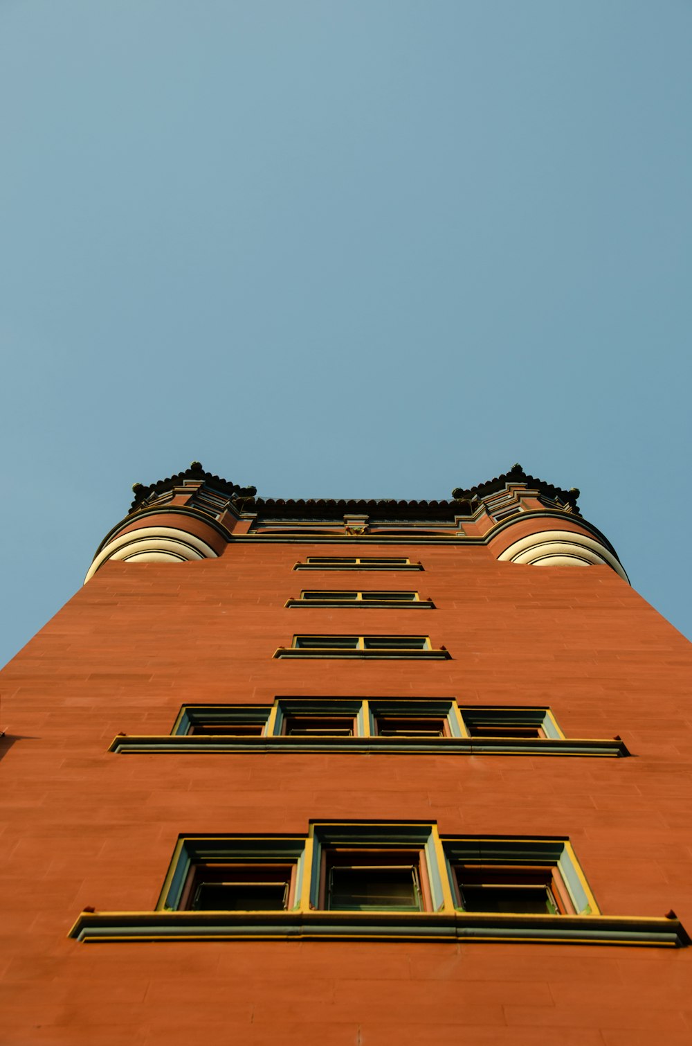 brown concrete building under blue sky during daytime