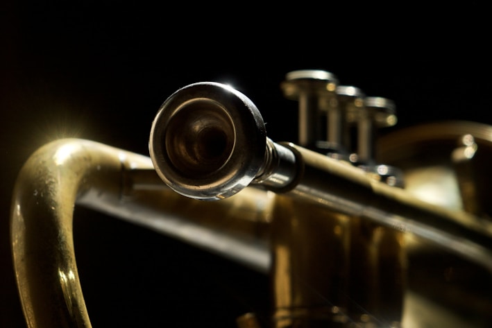 brass trumpet in close up photography