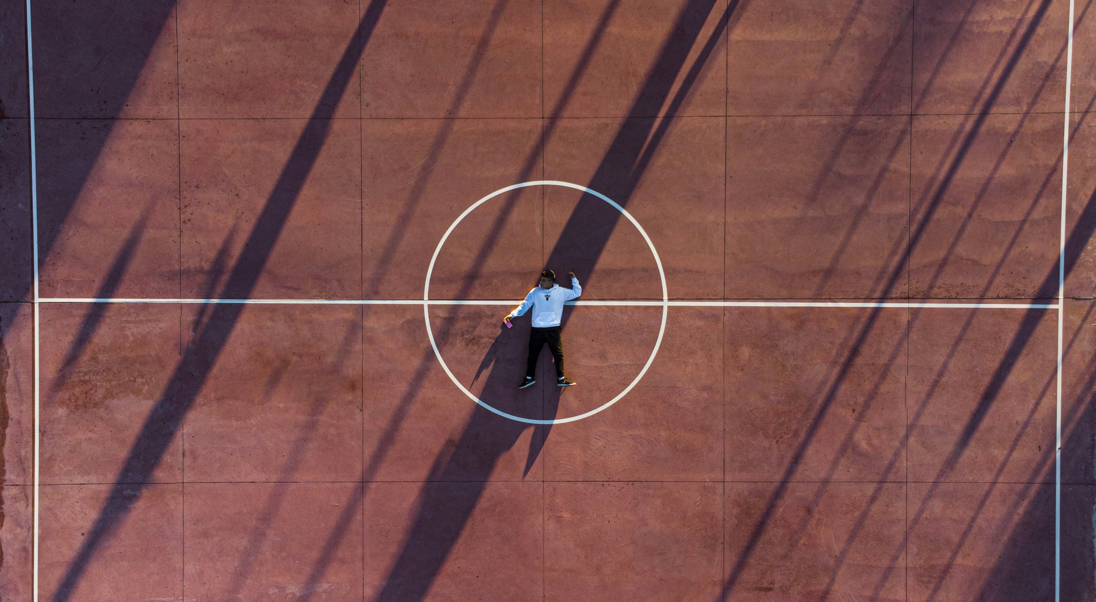 A dramatic shot of a baseball field from the perspective of a player walking out of the dugout, symbolizing a journey and a challenge ahead.