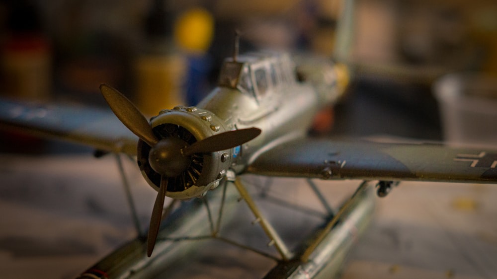 white and blue airplane scale model