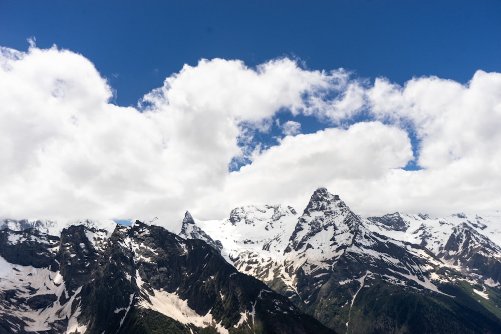 snow covered mountain under blue sky during daytime