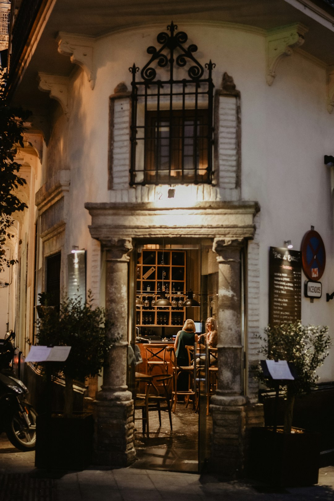 people sitting on chairs near building during daytime